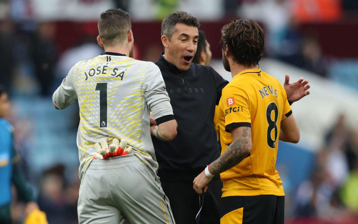 Wolverhampton Wanderers' Portuguese head coach Bruno Lage (C) celebrates with Wolverhampton Wanderers' Portuguese goalkeeper Jose Sa (L) and Wolverhampton Wanderers' Portuguese midfielder Ruben Neves at the final whistle during the English Premier League football match between Aston Villa and Wolverhampton Wanderers at Villa Park in Birmingham, central England on October 16, 2021 - - GETTY IMAGES