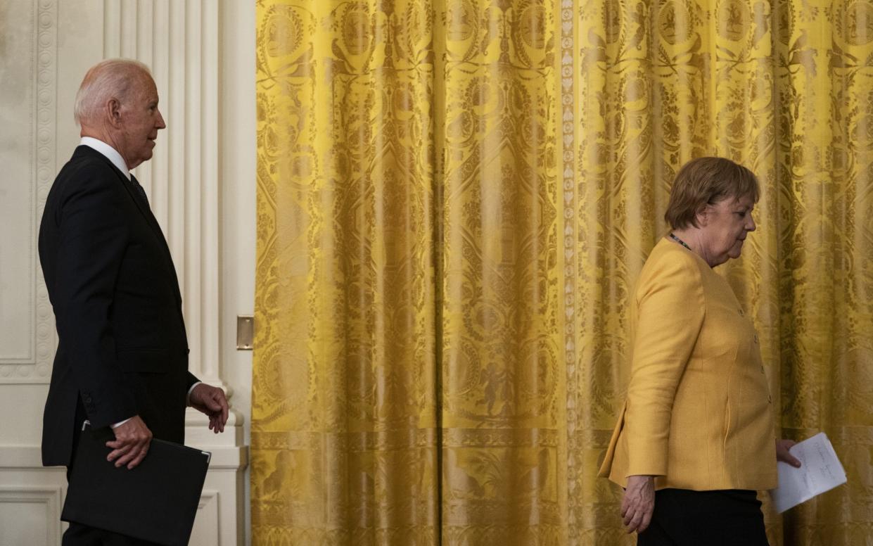 Joe Biden, right, and Angela Merkel, Germany's chancellor, depart a news conference in the East Room of the White House