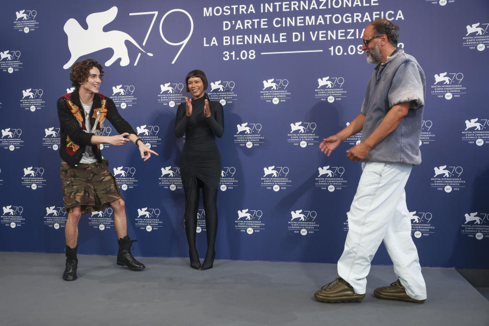 Timothee Chalamet, from left, Taylor Russell and director Luca Guadagnino pose for photographers at the photo call for the film 'Bones and All'during the 79th edition of the Venice Film Festival in Venice, Italy, Friday, Sept. 2, 2022. (Photo by Joel C Ryan/Invision/AP)