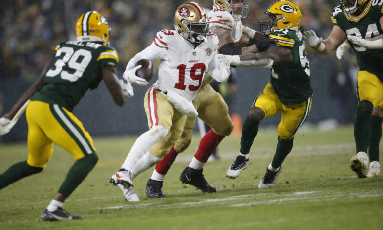 Deebo Samuel runs with the ball.