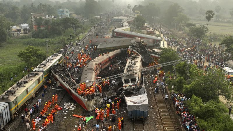 A drone shot of rescuers working at the site of a passenger train accident, in Balasore district, in the eastern Indian state of Odisha, Saturday, June 3, 2023.