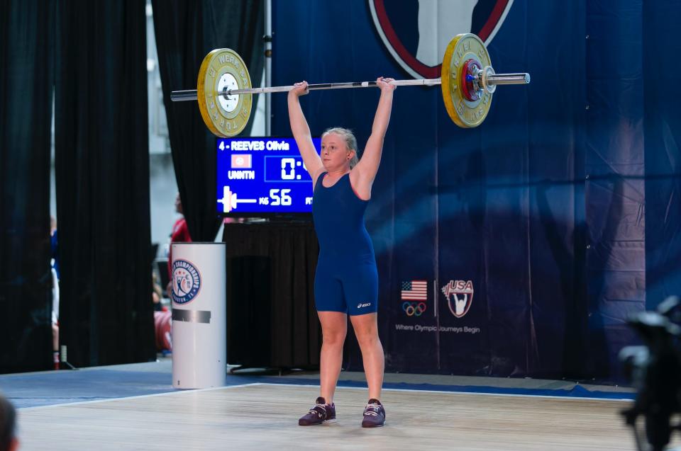 Olivia Reeves in 2017 weightlifting at her first national competition.