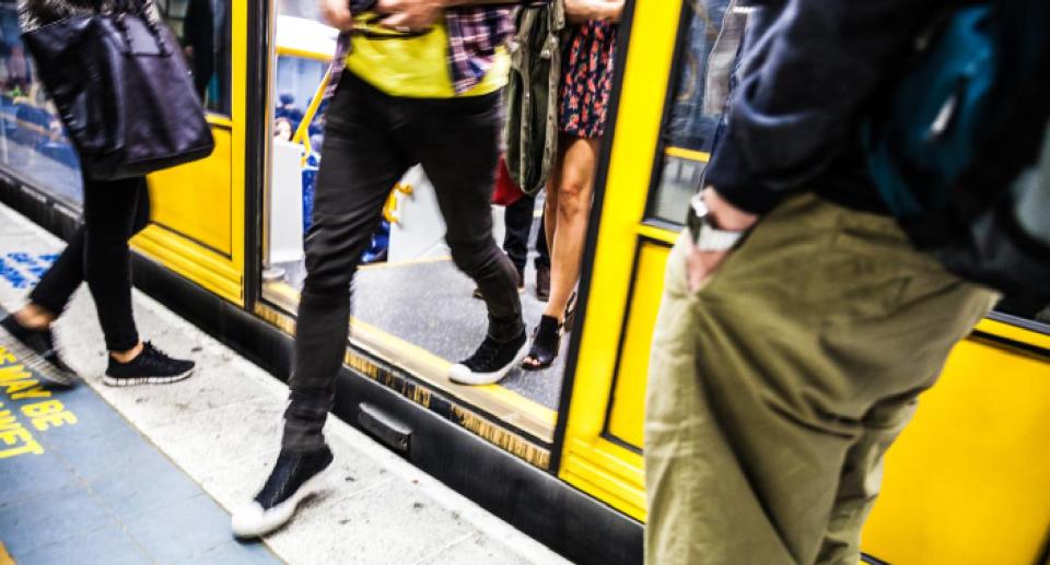 People exiting a public transport train at peak hour. Source: Getty Images