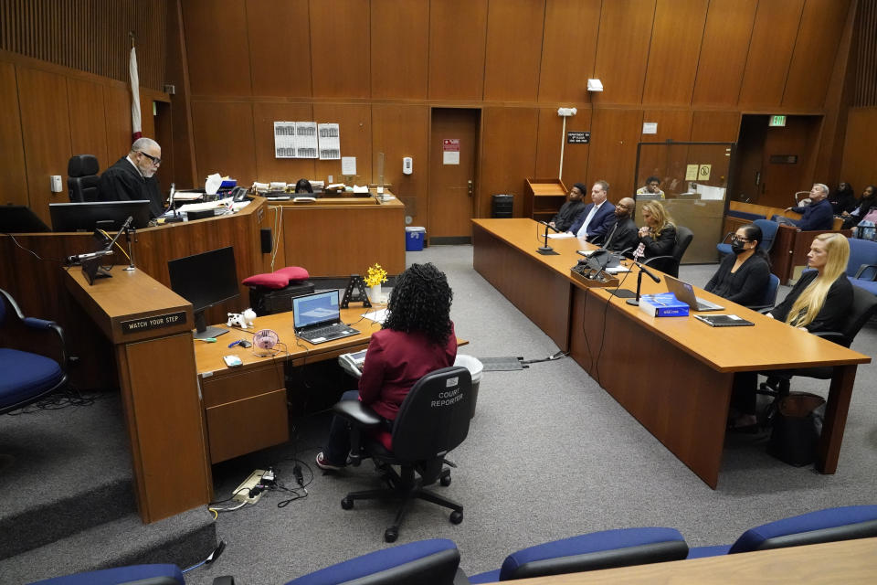 Judge Judge H. Clay Jacke, at left, reads his ruling on the case of the People vs. Juan Rayford and Dupree Glass at the Clara Shortridge Foltz Criminal Justice Center, Thursday, April 20, 2023, in Los Angeles. Rayford and Glass, sitting in front of Jacke, were convicted of attempted murder and sentenced to 11 consecutive life sentences. They served 17 years in prison before being released in 2020 after a judge ruled they were wrongfully convicted. (AP Photo/Marcio Jose Sanchez)