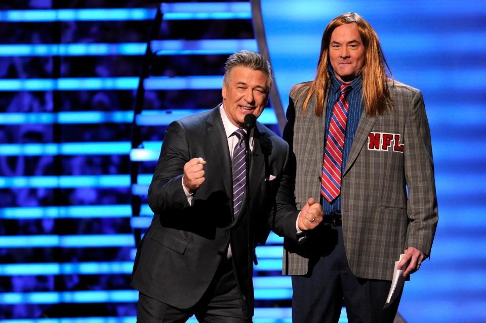 Host Alec Baldwin, left, and comedian David Koechner speak on stage at the third annual NFL Honors at Radio City Music Hall on Saturday, Feb. 1, 2014, in New York. (Photo by Evan Agostini/Invision for NFL/AP Images)