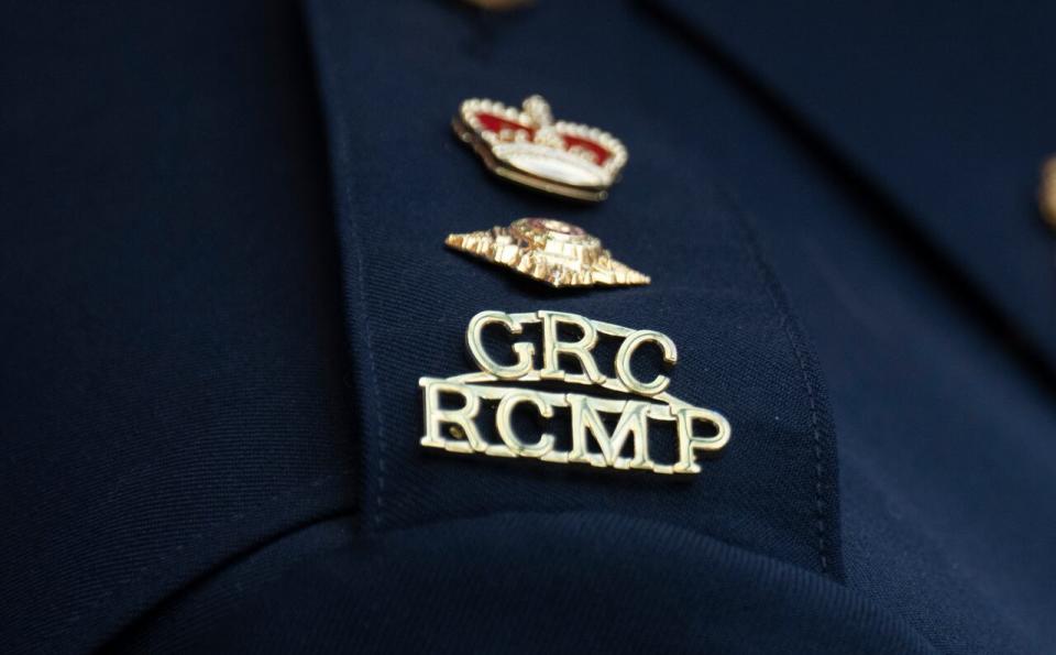 The RCMP logo is seen on the shoulder of a superintendent during a news conference, Saturday, June 24, 2023, in St. John’s, Newfoundland. The B.C. Coroners' Service has called an inquest into a 2019 police shooting that left two people dead, including the hostage officers were trying to save.