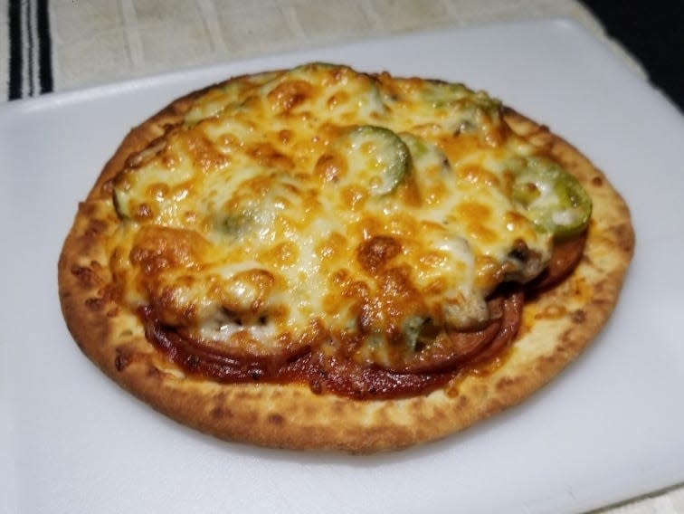 Home-made pizza on pita bread