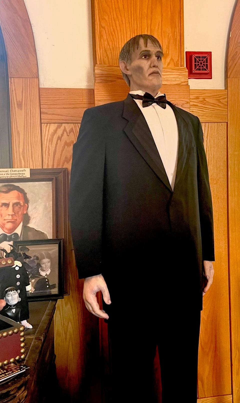 Yes, that is The Addams Family's Lurch, standing inside the museum.