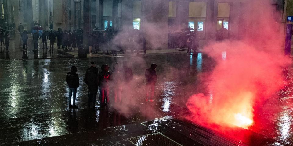 A small group of demonstrators gathered in Piazza Vittoria, Brescia, Italy, on October 26, 2020 to protest against the measures decided by the government. The new ordinance of the Prime Minister comes into force today. It provides, among other restrictions, the closure of bars and restaurants from 6 pm to 5 am and the total closure of theaters. (Photo by Stefano Nicoli/NurPhoto via Getty Images)