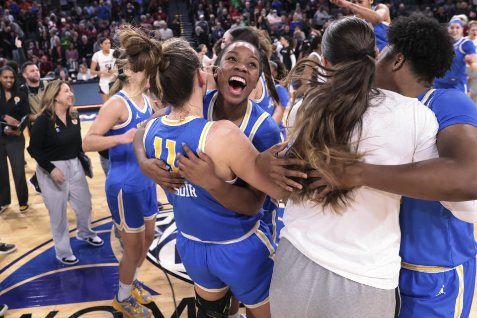 UCLA guard Charisma Osborne and forward Emily Bessoir knocked off Stanford on Friday night to reach the Pac-12 tournament championship game.