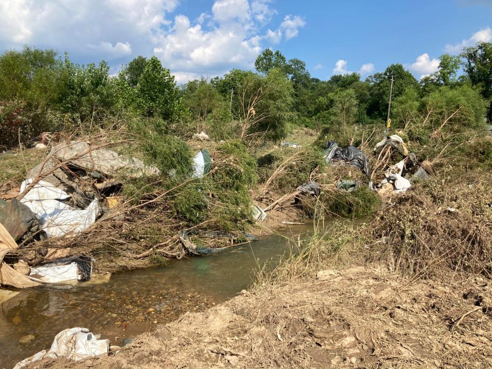 Debris is shown on Pole Creek in Buncombe County.