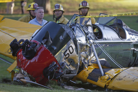 An airplane sits on the ground after crash landing at Penmar Golf Course in Venice, Los Angeles California March 5, 2015. REUTERS/Lucy Nicholson