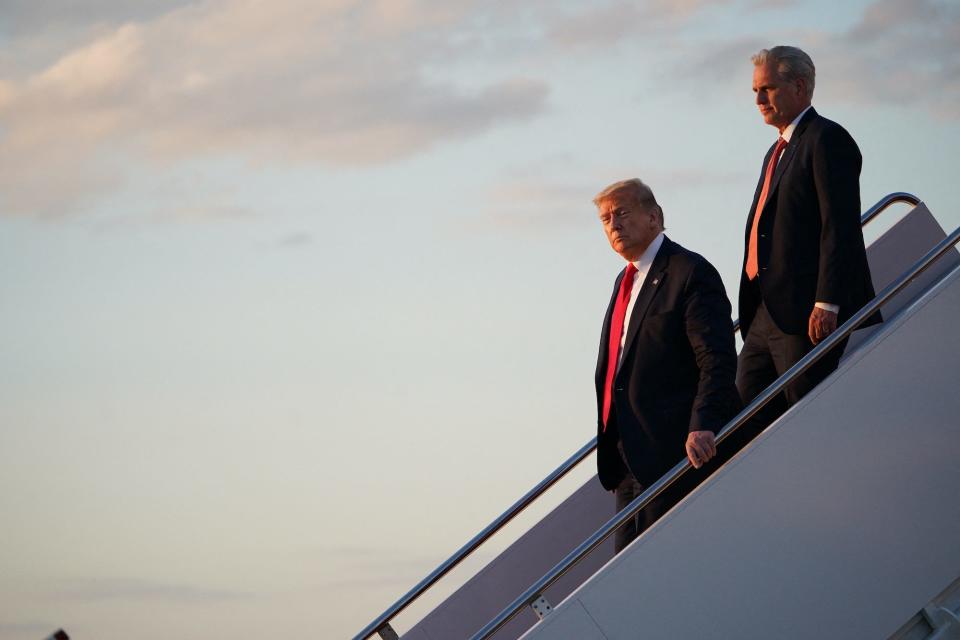 Then-US President Donald Trump followed by Republican Rep. Kevin McCarthy of California as he steps off Air Force One after returning from Cape Canaveral, Florida, on May 30, 2020 at Joint Base Andrews, Maryland.