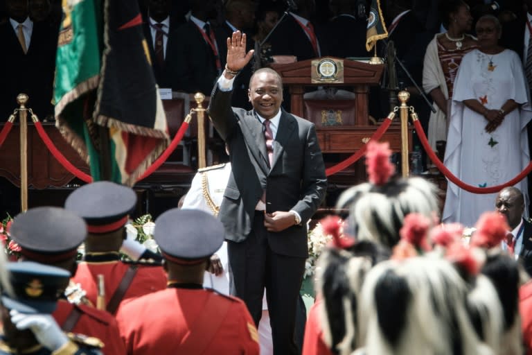 To critics, President Uhuru Kenyatta -- seen here at his inauguration ceremony on November 28 -- is resorting to authoritarianism