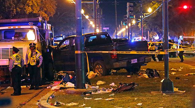 A ute slammed into a crowd and other vehicles, causing multiple injuries, before coming to a stop against a dump truck, during the New Orleans Mardi Gras. Picture: AP/Gerald Herbert