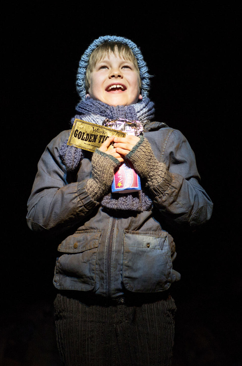 In this undated theater image released by The Corner Shop, Jack Costello portrays Charlie during a performance of the "Charlie And The Chocolate Factory." The musical, a reinterpretation by Oscar-winning director Sam Mendes, premieres Tuesday, June 25, 2013, at London's Theatre Royal Drury Lane. (AP Photo/The Corner Shop, Helen Maybanks)