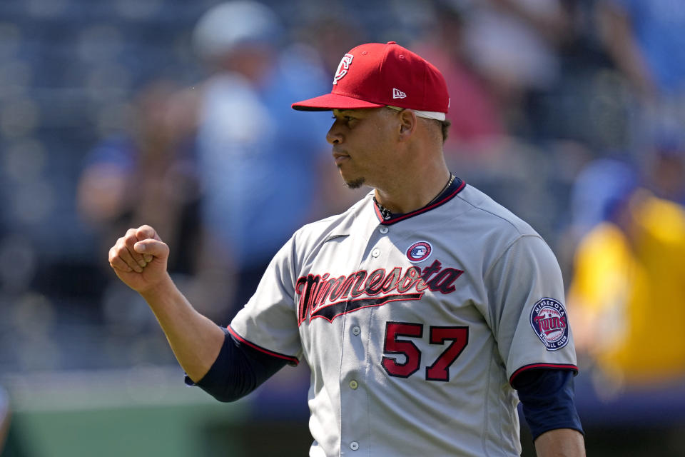 Minnesota Twins relief pitcher Hansel Robles celebrates after a baseball game against the Kansas City Royals Sunday, July 4, 2021, in Kansas City, Mo. The Twins won 6-2. (AP Photo/Charlie Riedel)