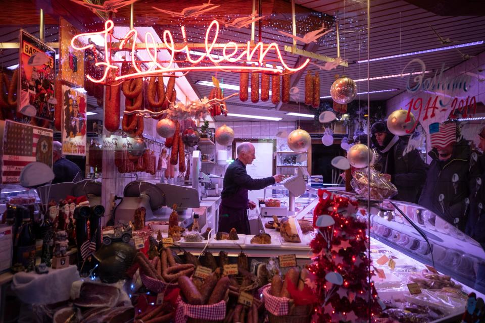 The scene through the window of a butcher shop on Rue du Sablon, in Bastogne, Belgium. Dec. 14, 2019