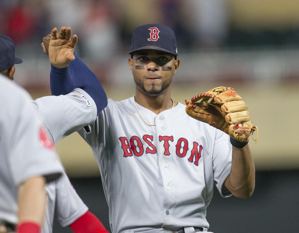 Boston Red Sox's Xander Bogaerts celebrates with teammates after defeating the Minnesota Twins in a baseball game Monday, June 17, 2019, in Minneapolis. (AP Photo/Andy Clayton- King)