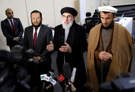 Former Afghan warlord Gulbuddin Hekmatyar (C) alongside his two vice-presidential candidates Fazil Hadi Wazeen and Qazi Hafizulrahman Naqi, speaks to the media after arriving to register as a candidate for the presidential election at Afghanistan's Independent Election Commission (IEC) in Kabul, Afghanistan January 19, 2019. REUTERS/Mohammad Ismail