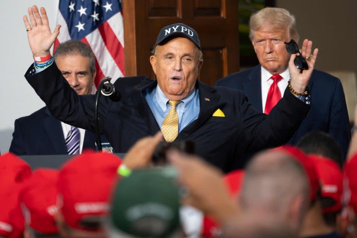 Trump and Rudy Giuliani appear together in August 2020 (AFP via Getty Images)
