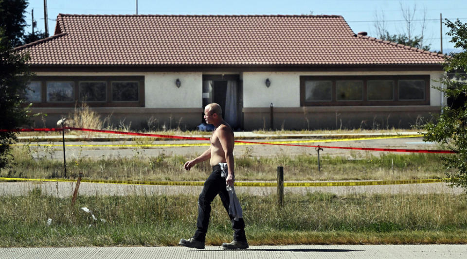 James Glidewell walks past the Return To Nature Funeral Home in Penrose, Colo. Thursday, Oct. 5, 2023. Authorities said Thursday they were investigating the improper storage of human remains at a southern Colorado funeral home that performs “green” burials without embalming chemicals or metal caskets. (Jerilee Bennett/The Gazette via AP)