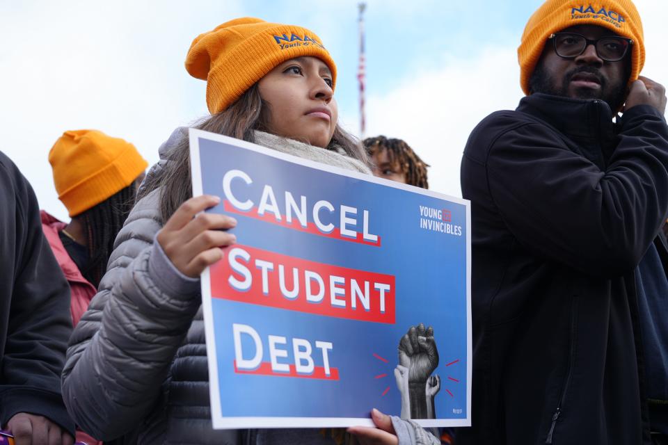 Protesters gather outside the Supreme Court on Feb. 28, 2023, ahead of oral arguments in cases challenging President Joe Biden's $400 billion student loan forgiveness plan.  In June of that year, a majority of justices ruled, along ideological lines, that the Biden administration had overstepped its power.