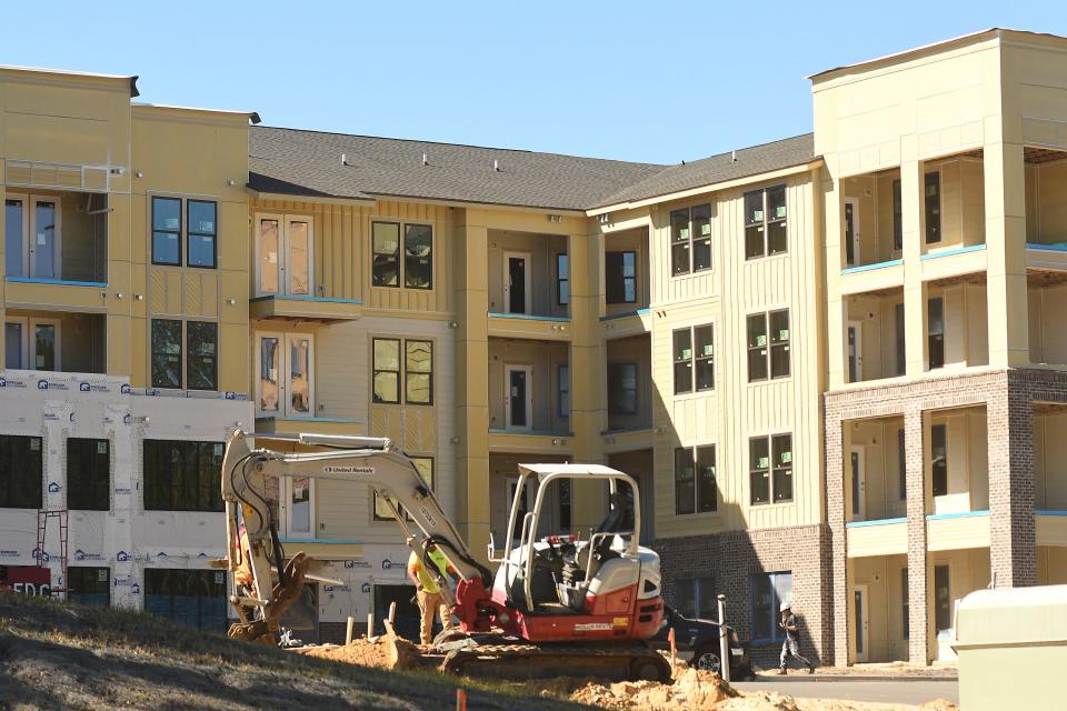 Construction continues on a new apartment complex on N.C. 133 in Leland in November.