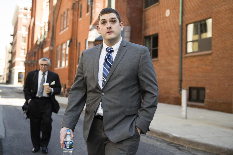 Former East Pittsburgh police officer Michael Rosfeld, charged with homicide in the shooting death of Antwon Rose II, walks to the Dauphin County Courthouse in Harrisburg, Pa., Tuesday, March 12, 2019. (AP Photo/Matt Rourke)