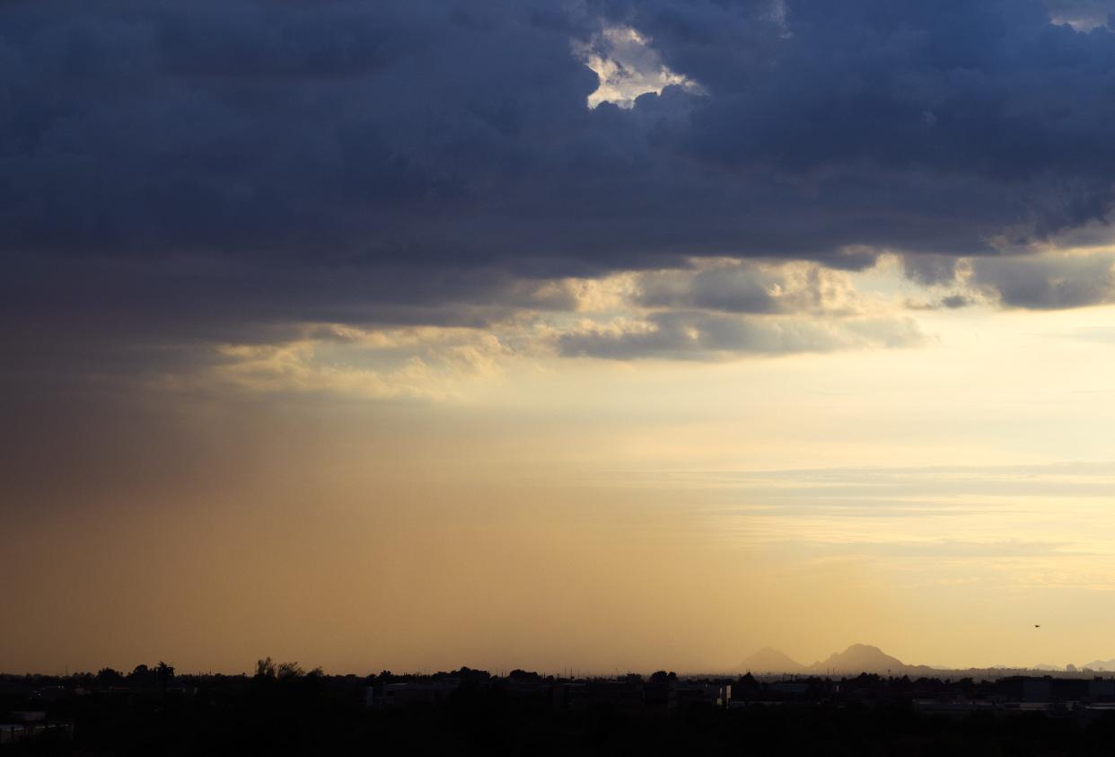 A dust storm covers Phoenix during a monsoon storm Sunday evening, July 24, 2022.