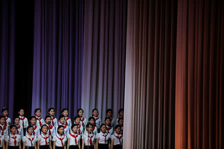 Girls are wheeled on a sliding platform to the stage at the Mangyongdae Children's Palace in Pyongyang, North Korea May 5, 2016. REUTERS/Damir Sagolj