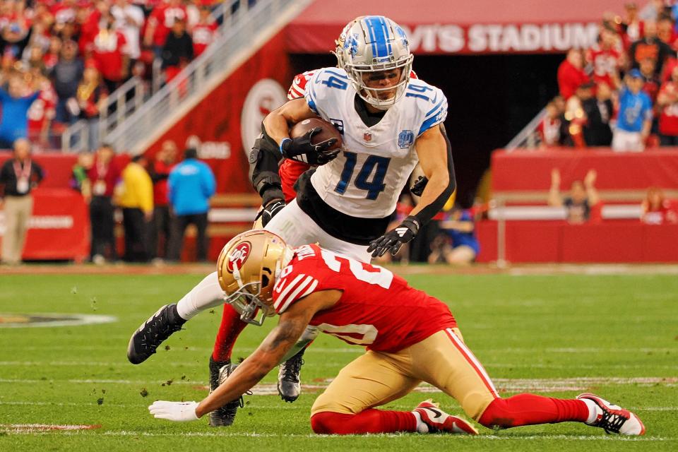 Jan 28, 2024; Santa Clara, California, USA; San Francisco 49ers cornerback Ambry Thomas (20) upends Detroit Lions wide receiver Amon-Ra St. Brown (14) during the first half of the NFC Championship football game at Levi's Stadium. Mandatory Credit: Kelley L Cox-USA TODAY Sports