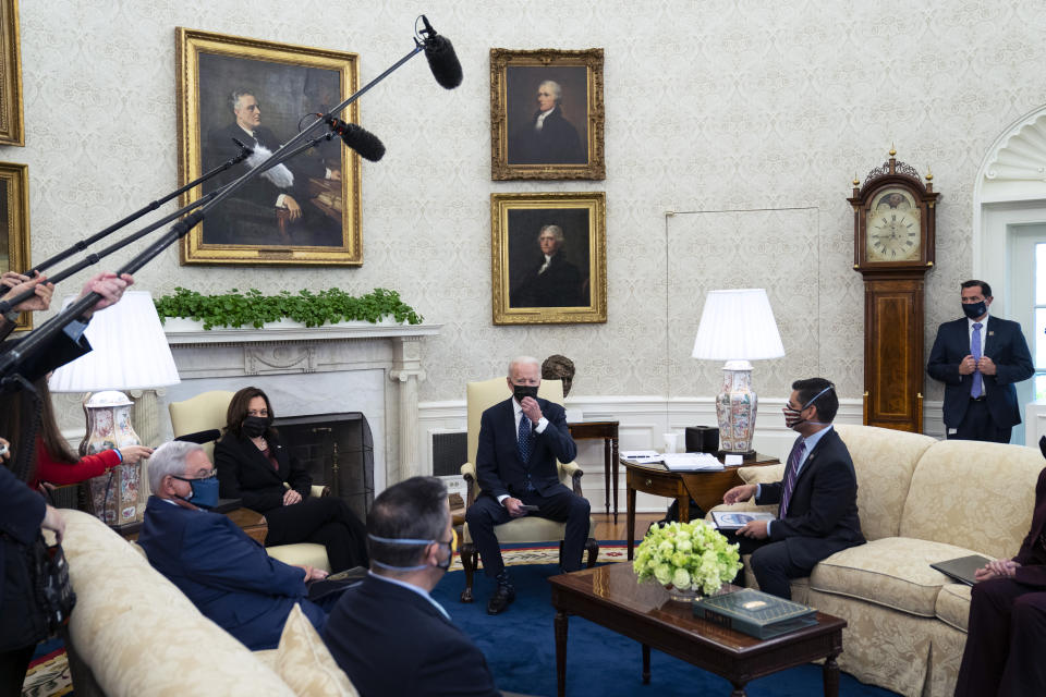 President Joe Biden and Vice President Kamala Harris meet with members of the Congressional Hispanic Caucus, in the Oval Office of the White House, Tuesday, April 20, 2021, in Washington. (AP Photo/Evan Vucci)