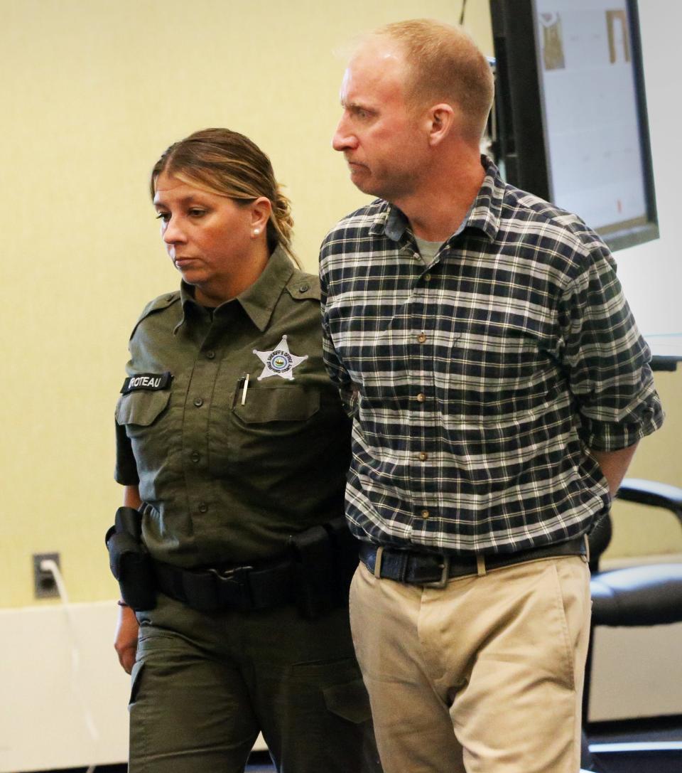 Scott Boire is led from Strafford County Superior Court in handcuffs after being sentenced for causing the death of Gloria Snowman in a car crash as a habitual offender in driving while intoxicated.