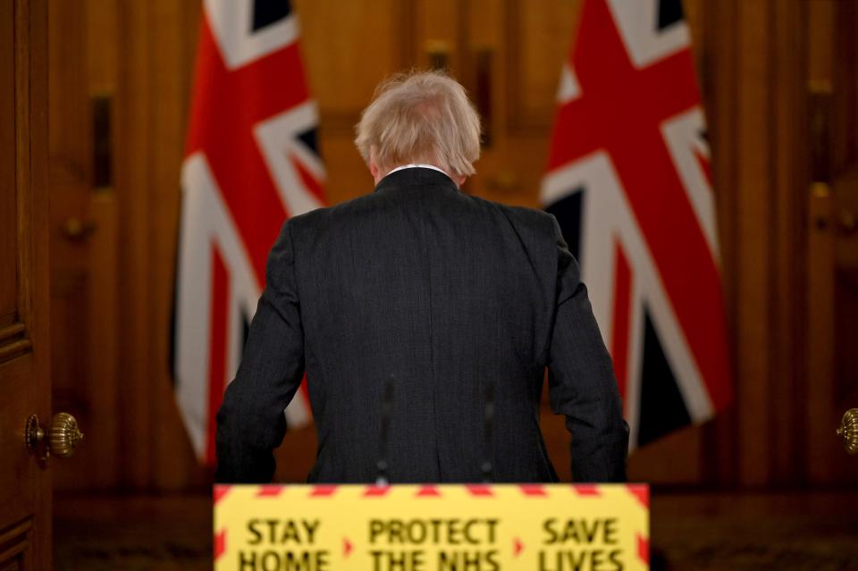 Britain's Prime Minister Boris Johnson leaves a virtual press conference on the novel coronavirus COVID-19 pandemic, at 10 Downing Street in central London on January 22, 2021. - There is "some evidence" that the new strain of coronavirus identified in Britain is not only more transmissible but also more deadly, Prime Minister Boris Johnson said Friday. "It also now appears that there is some evidence that the new variant... may be associated with a higher degree of mortality," he said at a Downing Street press conference. (Photo by Leon Neal / POOL / AFP) (Photo by LEON NEAL/POOL/AFP via Getty Images)