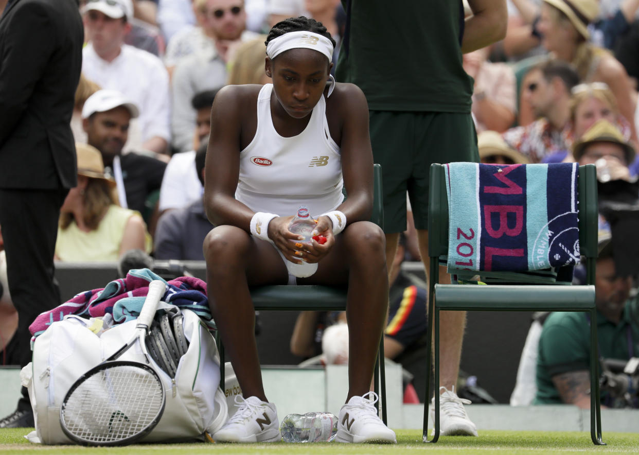United States' Cori "Coco" Gauff is dejected after losing to Romania's Simona Halep in a women's singles match against on day seven of the Wimbledon Tennis Championships in London, Monday, July 8, 2019. (AP Photo/Kirsty Wigglesworth)