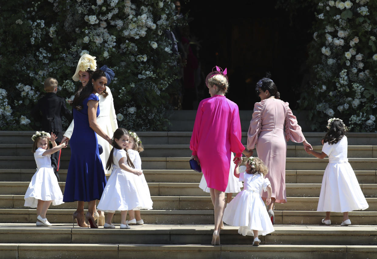 Kate, the Duchess of Cambridge, foreground left and Jessica Mulroney arrive with the bridesmaids for the wedding ceremony of Prince Harry and Meghan Markle at St. George’s Chapel in Windsor Castle in Windsor, near London, England, Saturday, May 19, 2018. (Jane Barlow/pool photo via AP)