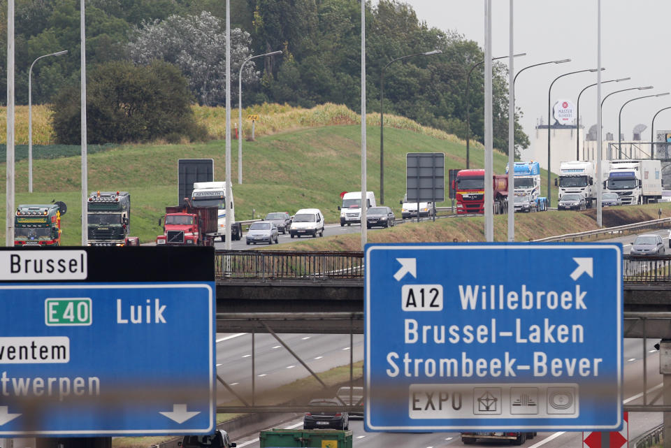 Trucks drive on the Brussels ring road, as they participate in a demonstration, Monday Sept. 24, 2012. Truckers seek to disrupt morning traffic heading into the capital to protest competition from eastern Europe, which undercuts prices and lowers labor standards. (AP Photo/Yves Logghe)