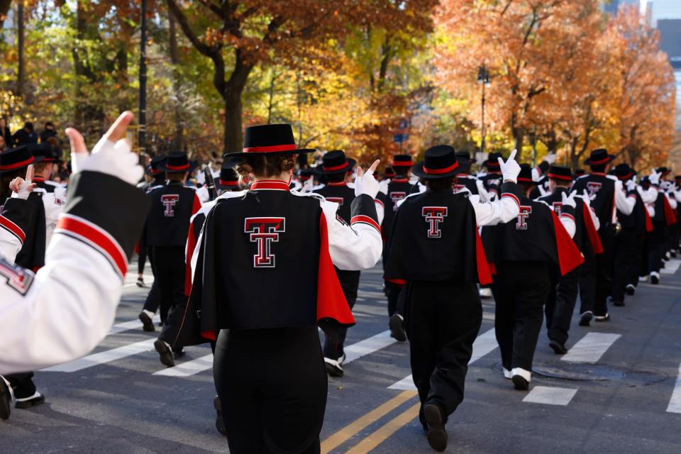 Goin' Band from Raiderland marching in Macy's Thanksgiving Day Parade with their "Guns Up" on Nov. 23 in New York City, New York.