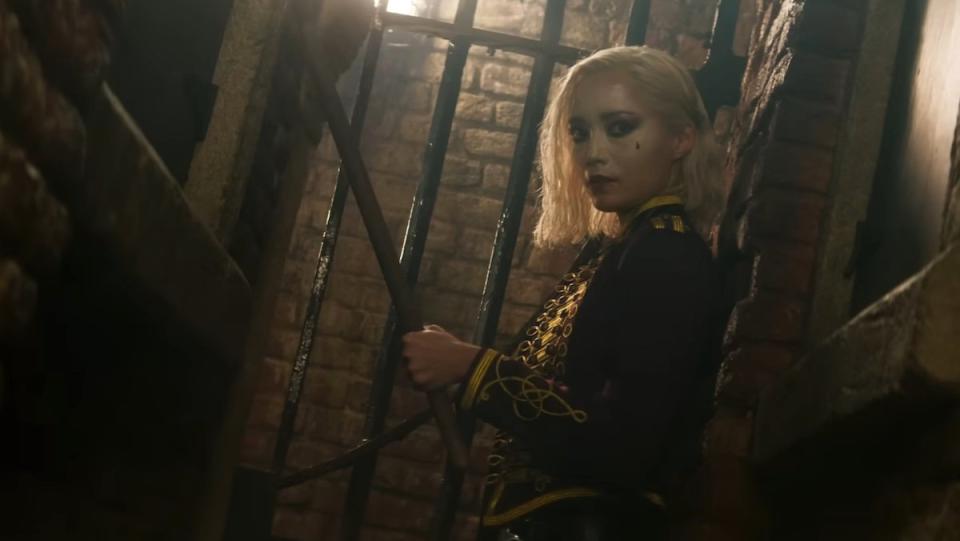 Pom Klementieff dressed like a mine in an alleyway holding a metal rod in Mission: Impossible - Dead Reckoning