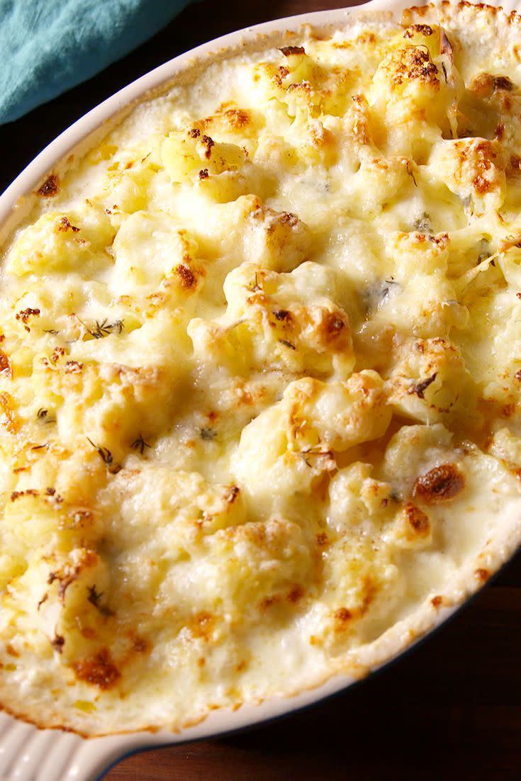 <p>We've gratin'd almost everything from the classic <a href="https://www.delish.com/cooking/recipe-ideas/recipes/a58285/easy-homemade-potatoes-au-gratin-recipe/" rel="nofollow noopener" target="_blank" data-ylk="slk:potatoes;elm:context_link;itc:0;sec:content-canvas" class="link ">potatoes</a> to <a href="https://www.delish.com/cooking/nutrition/a30297303/cheesy-cabbage-gratin-recipe/" rel="nofollow noopener" target="_blank" data-ylk="slk:cabbage;elm:context_link;itc:0;sec:content-canvas" class="link ">cabbage</a> and <a href="https://www.delish.com/cooking/recipe-ideas/recipes/a52242/cheesy-scalloped-zucchini-recipe/" rel="nofollow noopener" target="_blank" data-ylk="slk:zucchini;elm:context_link;itc:0;sec:content-canvas" class="link ">zucchini</a><em>,</em> but our favorite might just be this cheesy cauliflower bake. The butter and the cream add some richness to the cauliflower while the Parmesan imparts a sharp, salty cheesiness. Yum!</p><p>Get the <strong><a href="https://www.delish.com/cooking/recipe-ideas/recipes/a50583/cheesy-cauliflower-bake-recipe/" rel="nofollow noopener" target="_blank" data-ylk="slk:Cheesy Cauliflower Bake recipe;elm:context_link;itc:0;sec:content-canvas" class="link ">Cheesy Cauliflower Bake recipe</a></strong>.</p>