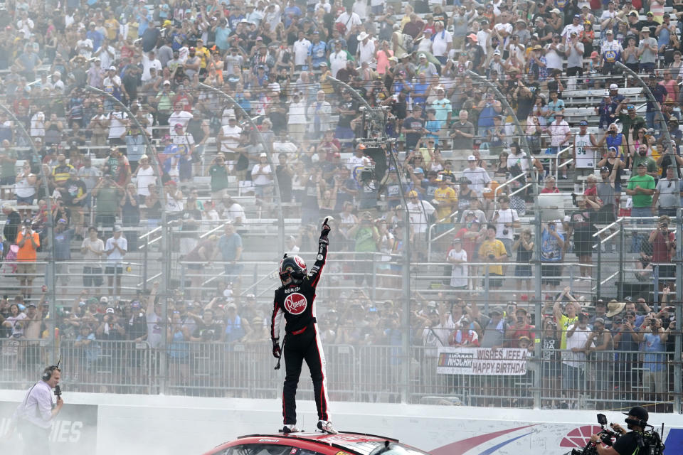 Christopher Bell celebrates after winning a NASCAR Cup Series auto race at the New Hampshire Motor Speedway, Sunday, July 17, 2022, in Loudon, N.H. (AP Photo/Charles Krupa)