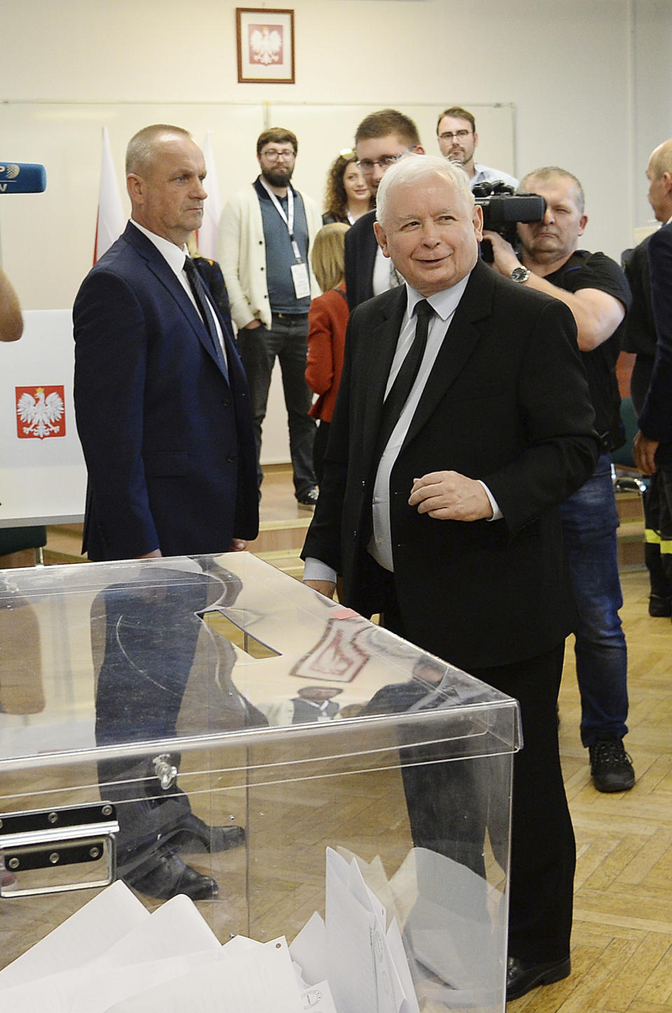 The ruling party leader Jaroslaw Kaczynskismiles after his vote at a polling station in Warsaw, Poland, Sunday, Oct. 13, 2019. Poles are voting Sunday in a parliamentary election that Kaczynski is favored to win easily, buoyed by the popularity of its social conservatism and generous social spending policies that have reduced poverty. (AP Photo/Czarek Sokolowski)