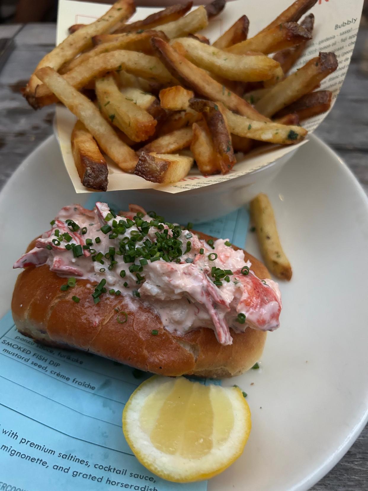 A fresh lobster roll with fries at The Optimist.