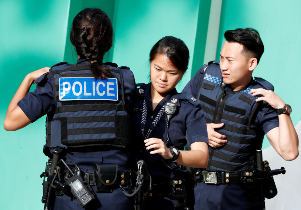 Police gear up before a simulated gunmen attack demonstration for the public at a housing estate in Singapore on 10 December, 2017. (Reuters file photo)