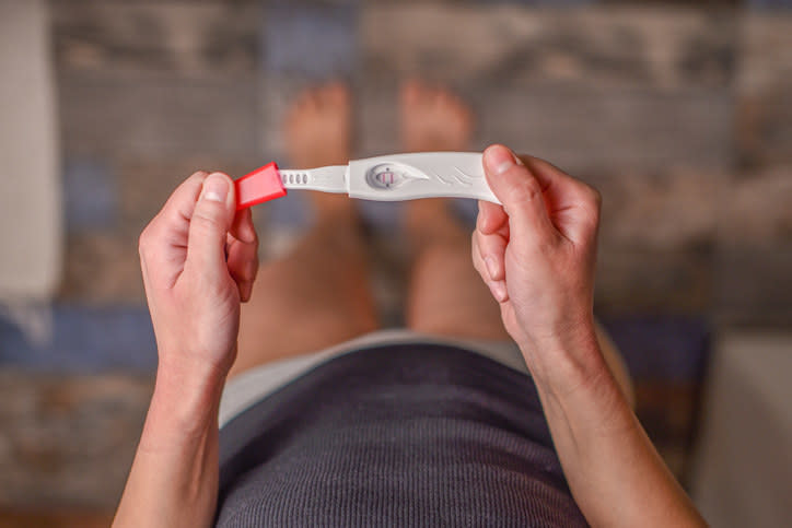 Person holding a pregnancy test