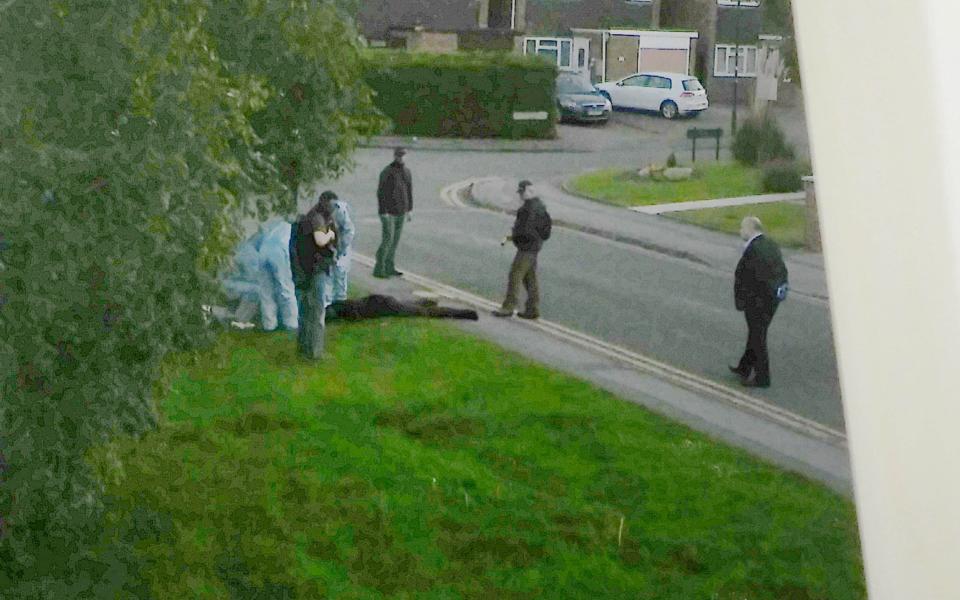 A terror suspect is arrested in the street after fleeing a property raided by police in Nuneaton, Warks, - Credit:  Caters News Agency