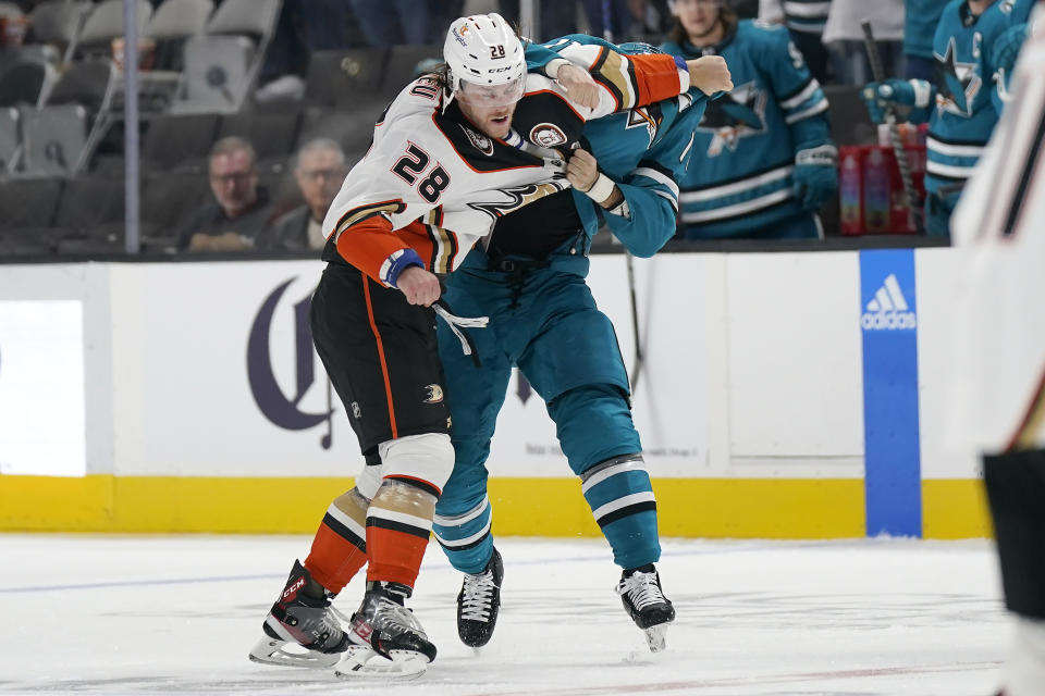 Anaheim Ducks defenseman Nathan Beaulieu (28) fights with San Jose Sharks center Luke Kunin during the second period of an NHL hockey game in San Jose, Calif., Tuesday, Nov. 1, 2022. (AP Photo/Jeff Chiu)