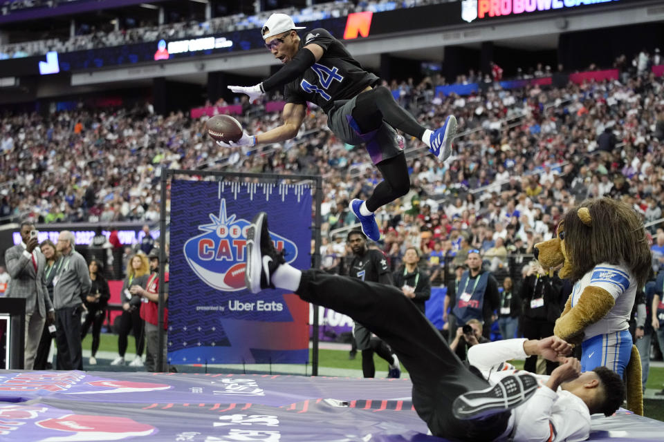 NFC wide receiver Amon-Ra St. Brown of the Detroit Lions makes a catch during the best catch football event at the NFL Pro Bowl, Sunday, Feb. 5, 2023, in Las Vegas. (AP Photo/John Locher)