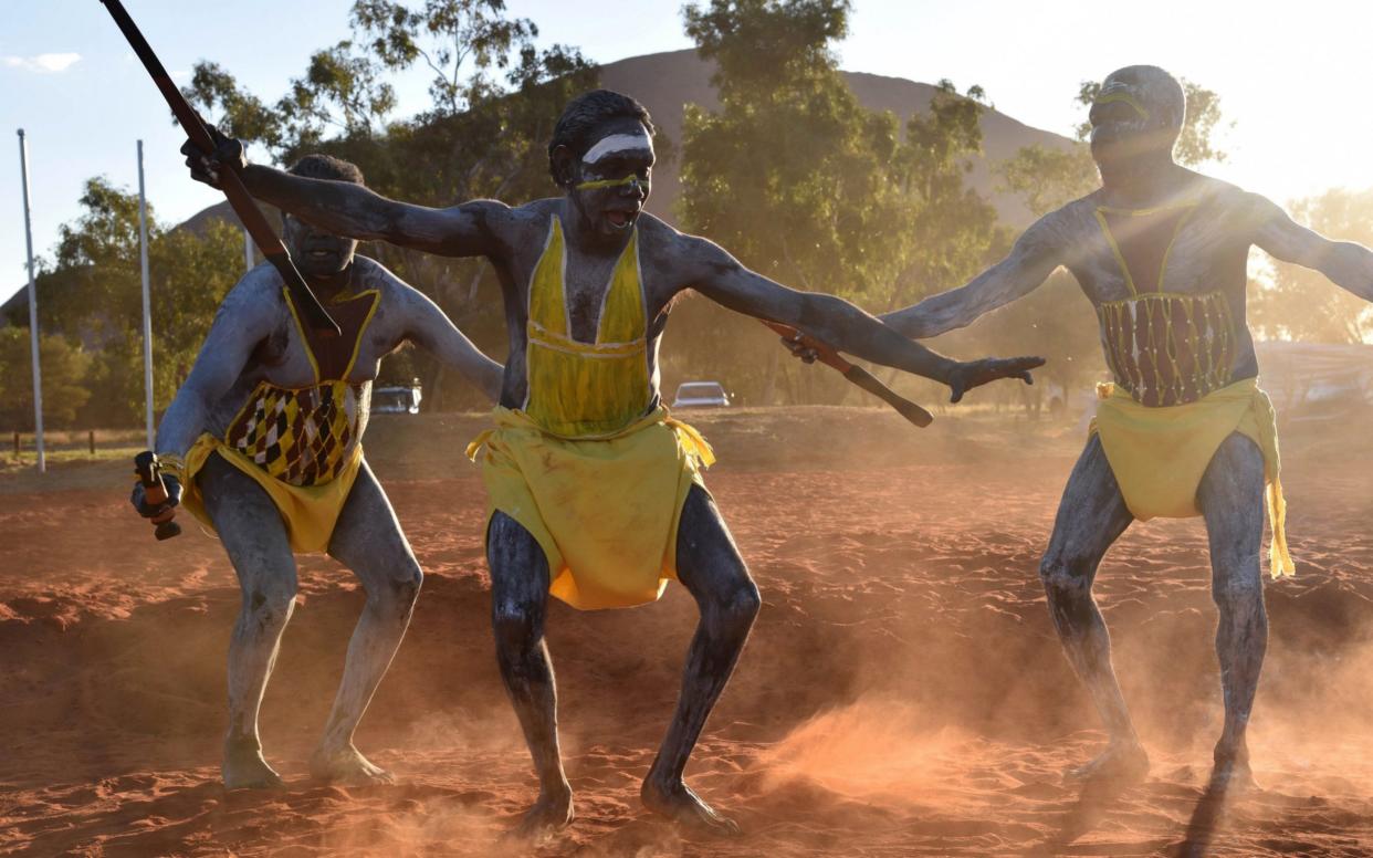 Dancers from East Arnhem Land at the opening ceremony for the National Indigenous Constitutional Convention in Mutitjulu near Uluru, Northern Territory, Australia - AAP